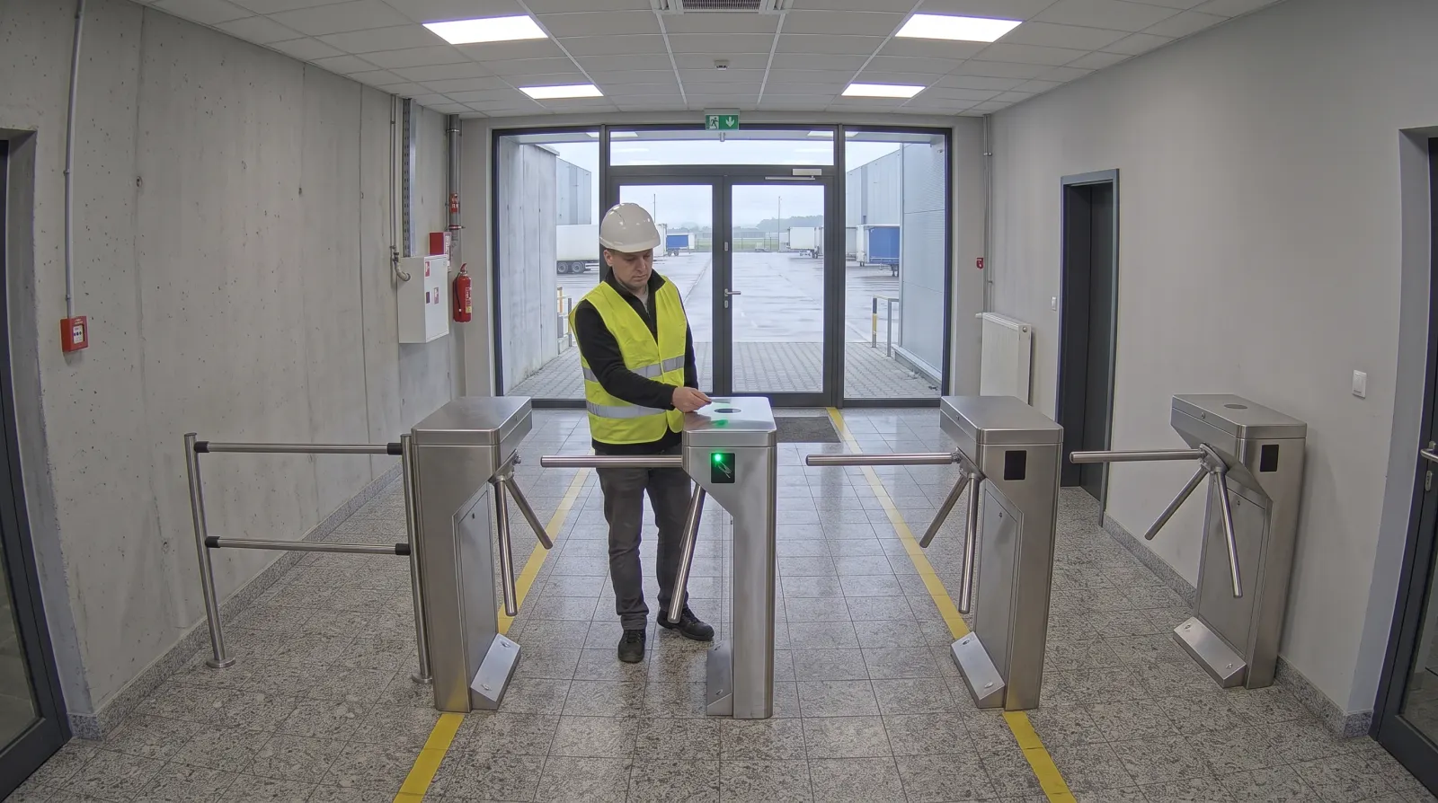 Illustrative camera frame in the entrance lobby: a worker in a hard hat holds a card to the turnstile reader, with more turnstiles, a technical cabinet and a door alongside. Overlaid are the numbered mounting points, the card-read frame and a card showing the access decision.